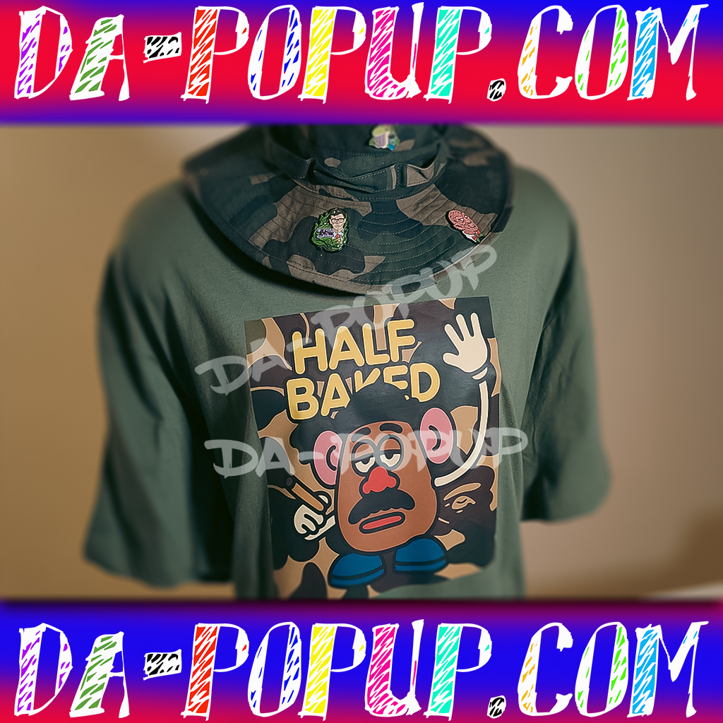 Green t-shirt with army camo background featuring a parody of Mr. Potato Head and Half Baked text in bold lettering