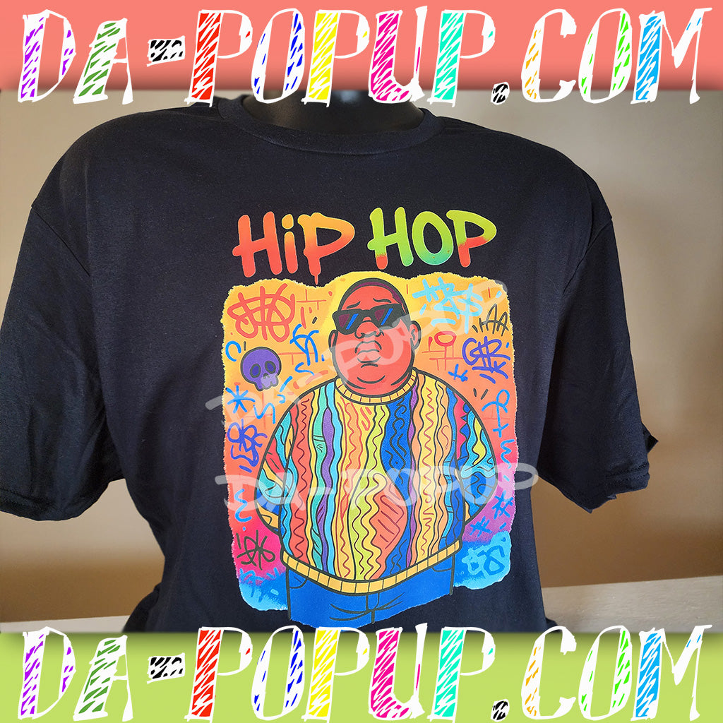 Black hip hop t-shirt featuring a colorful cartoon graphic of Biggie Smalls with graffiti art background
