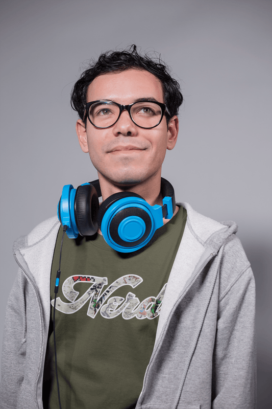 DESIGNER HEADPHONES GREY SWEATER WHITE WALL HANDHELD BLACK GLASSES SMILE